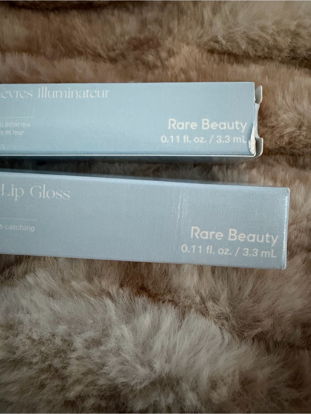 Rare Beauty Lip Gloss in Pale Blue Packaging